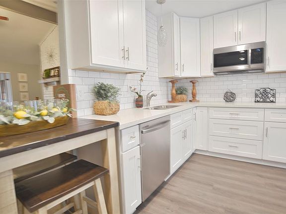Abundant storage includes lazy suzan, large pot & pan drawers, stainless appliances & more!