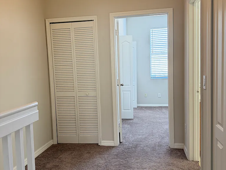 Upstairs hallway. Carpet is a little over a year old.