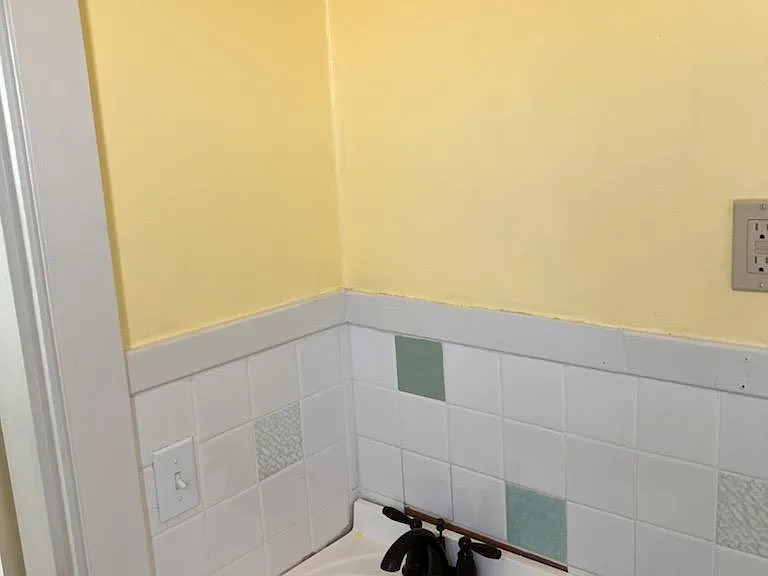 Bathroom. Restored tile and sink.