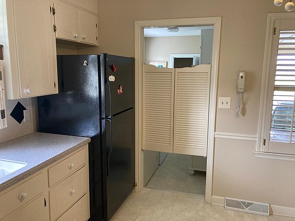 Kitchen looking toward Laundry area and half bath