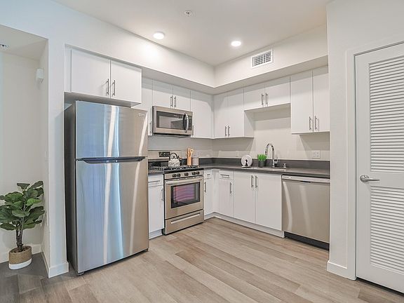 Another view of the fully equipped and modern kitchen that residents can expect at The Centennial.