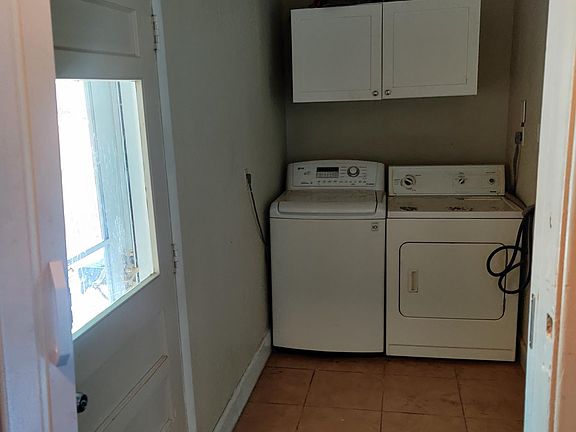 Your own entrance through the back door in a shared laundry room!
