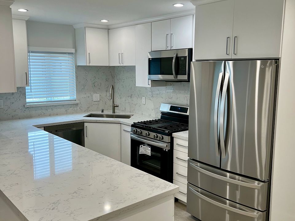 Beautifully Upgraded and Remodeled Kitchen with Stone Counters, Stainless Steel Appliances and Custom Cabinets