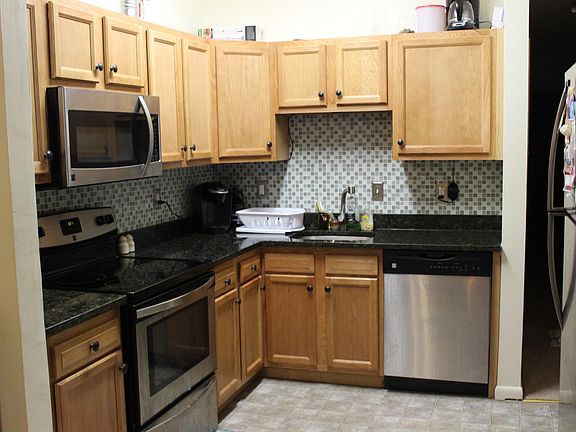 Kitchen with stainless appliance and stone countertops