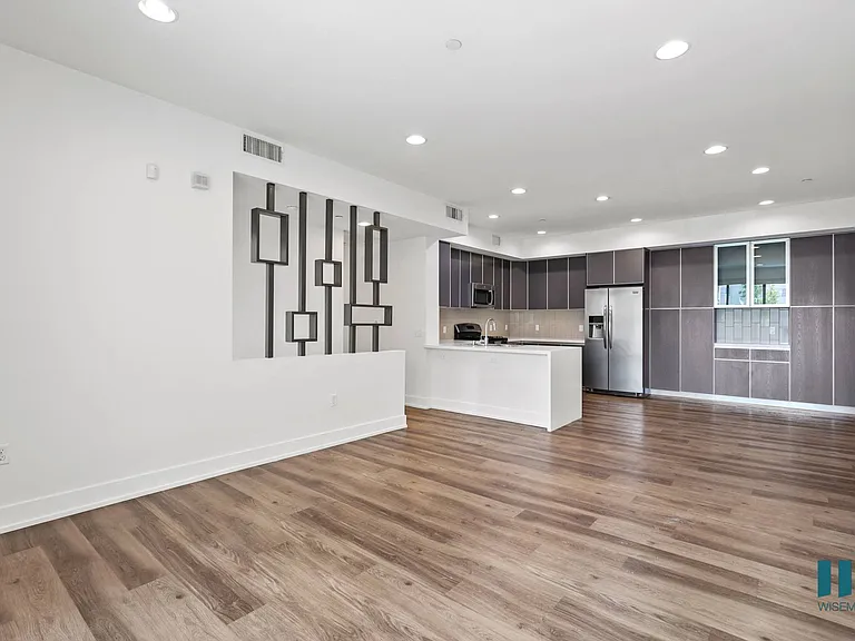 Living Room with Recessed Lighting, Vinyl Flooring, and Patio