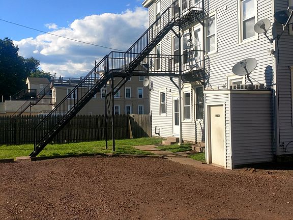 Yard, basement entrence and part of parking lot