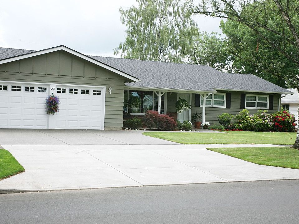 Front of the home, clean, mature landscaping