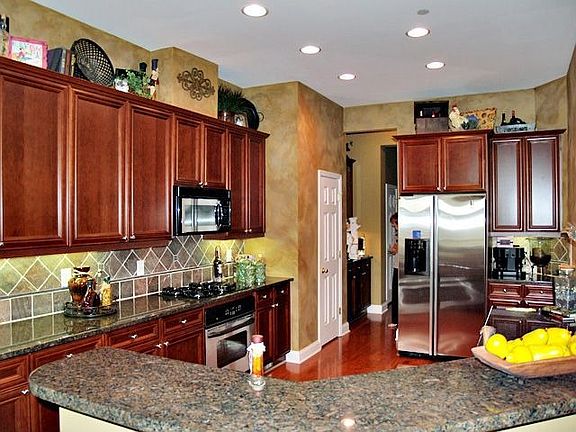 Granite, slate tile backspash w/ copper accents, stainless appl. and more!!