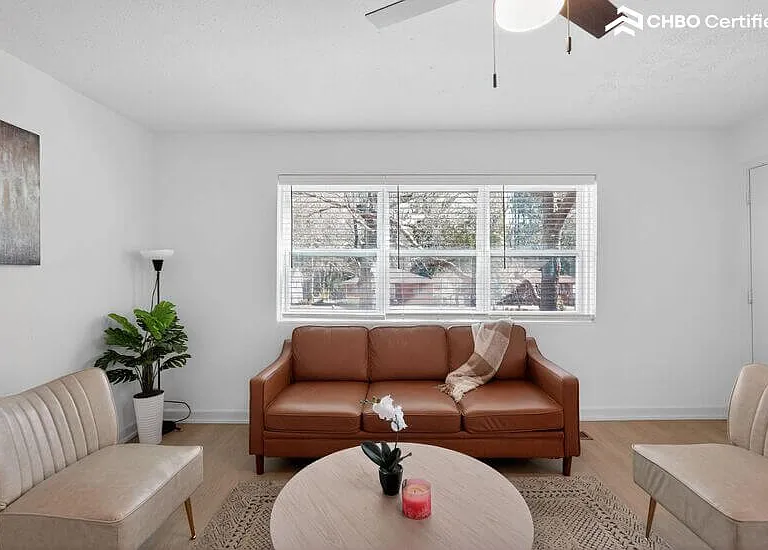 A bright, inviting living space featuring a comfortable sofa