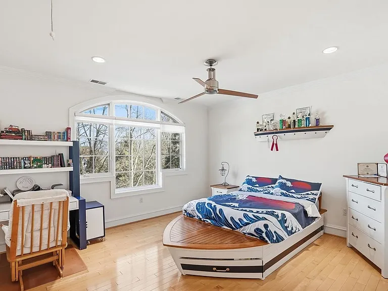 Serene bedroom with nautical charm.