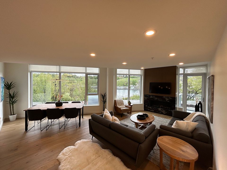 Living area with Bow River riverfront views out every window.