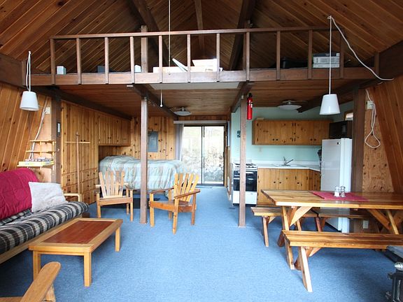 Knotty pine accents throughout the main floor of this cabin.