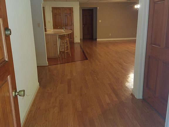 PRIVATE ENTRANCE, DISPLAYING SOLID WOOD DOOR AND HARDWOOD FL