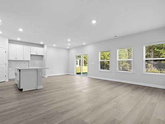 The stunning open-concept floorplan allows for easy flow between the kitchen and dining areas.