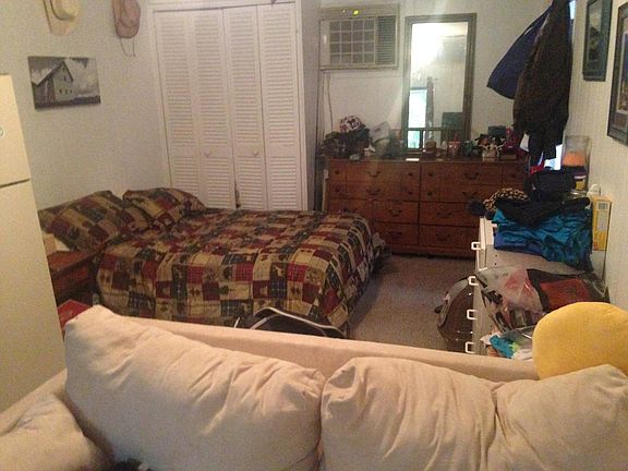 shows how furniture could be arranged in the studio ! Studio comes ____ unfurnished !