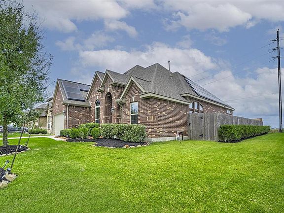 House sits on a corner lot and features solar panels and a mosquito control system
