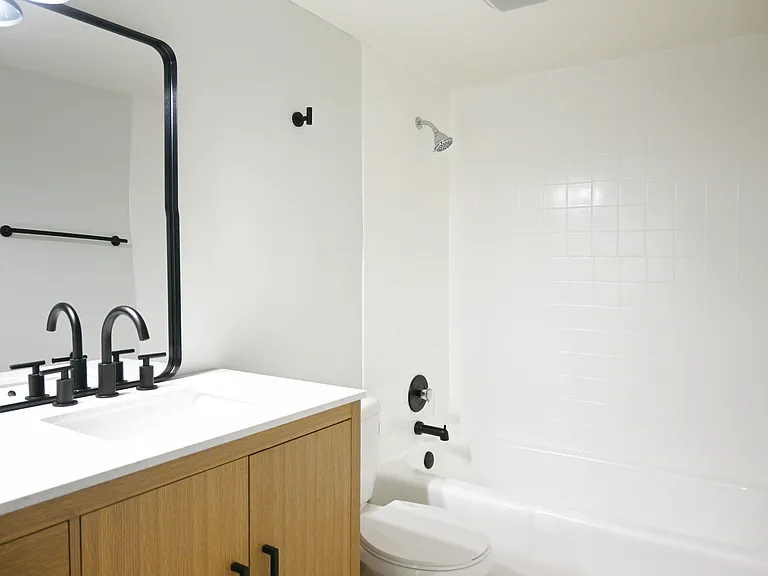 Large black framed mirror in bathroom at Cielo 120.