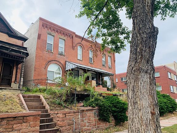 Charming building with lovely protected front porch on a quiet street close to all of the action. The location up on a hill overlooking Denver provides views of downtown.