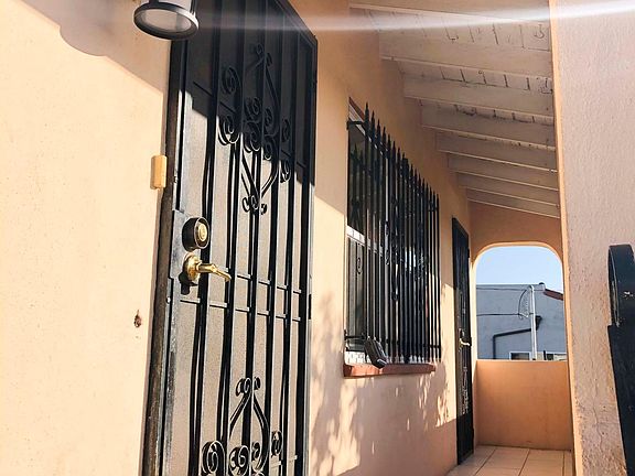 Patio with enough room to fit chairs and a small table.