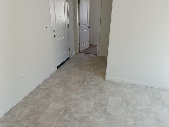 Photo of entry area to apartment taken before furnishing