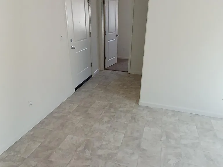 Photo of entry area to apartment taken before furnishing
