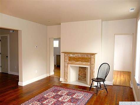 The Front Parlor with marble window sills and original mantl