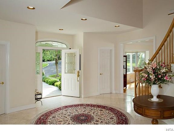 Just a hint of drama. Entry way with powder room separates the formal living room and the formal dining room