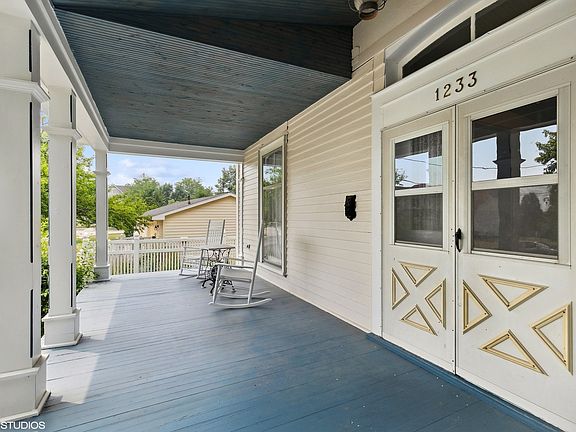 Open front porch, perfect for rocking, reading and enjoying the neighborhood. Painted wood flooring 