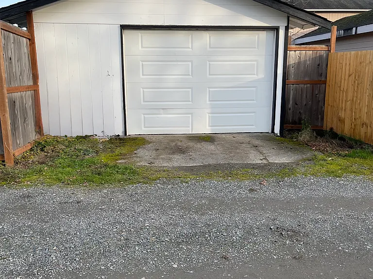 Detached Garage w/ Fully fenced back yard. Gated access to park additional vehicles if needed. (Will be repainted in Spring when warmer)