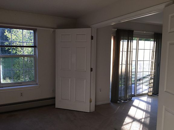 Bedroom looking into living room, bedroom has walk in closet