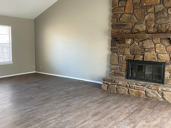 Great room open to large dining area and kitchen, new upgrade vinyl plank flooring, high ceilings and beamed ceilings.
