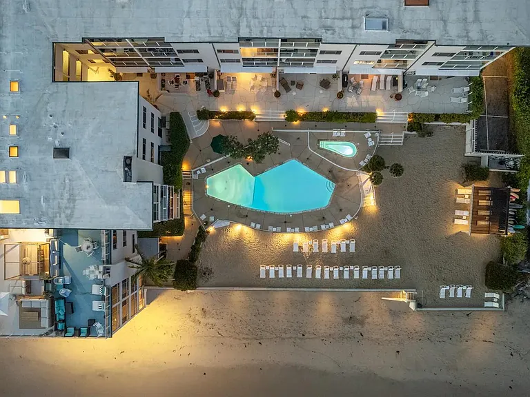 Embrace the ease of beachfront living with direct access, where sandy shores meet your doorstep.