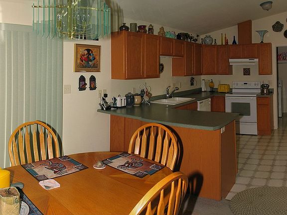 Dining Room & Kitchen w/ Skylight