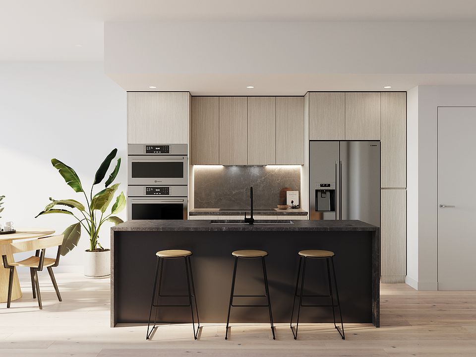Cook delicious dishes in this neutral and sleek color scheme kitchen.