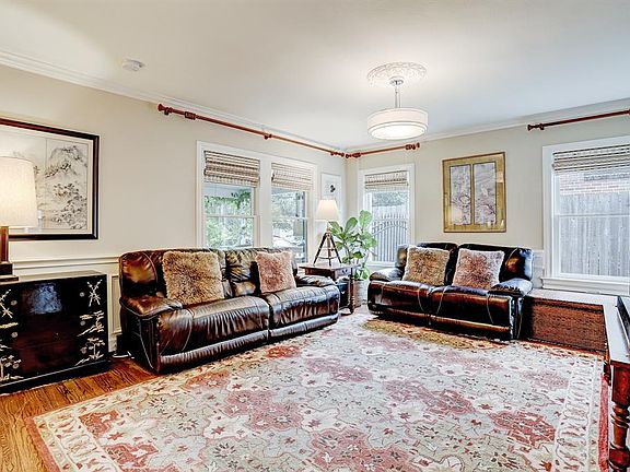 Light and airy Formal living room with views to the front porch and street beyond.