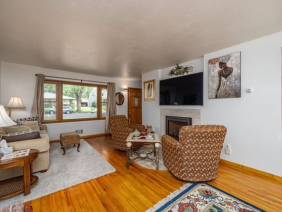 Living area with remote control gas fireplace (so cozy warm in winter) and big screen tv.