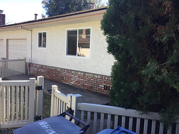 Front of building with garage door on left