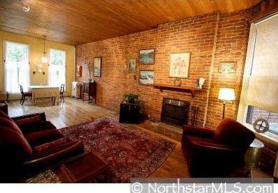Exposed brick with charming fireplace