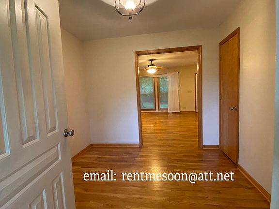 View from the front door looking into the foyer and on to the den in the back of the home.