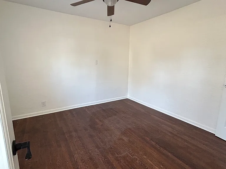 Room off of entry: Frosted-windowed french doors allow for privacy (bedroom/office) or for the doors to be left open for more general use.