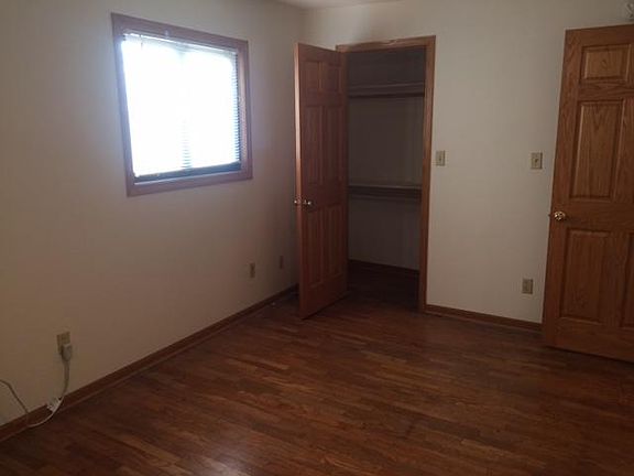 Bedroom with hardwood floor and large closet