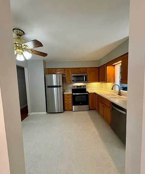 Updated kitchen feature brand new Whirlpool stainless steel appliances and ceramic tile floor.
