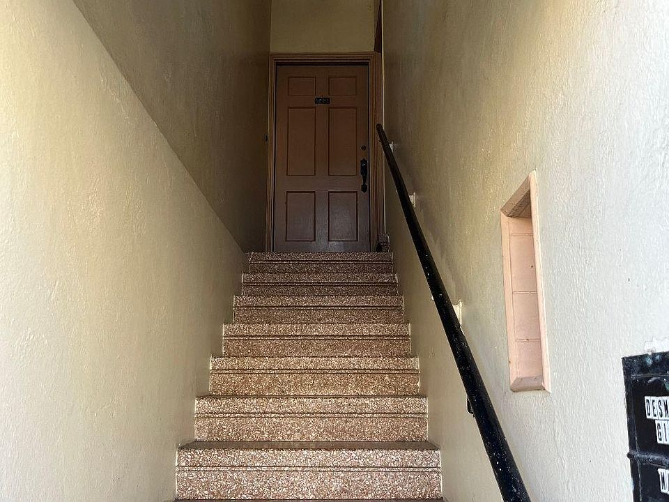 Gate at the end of stairs and own door into flat