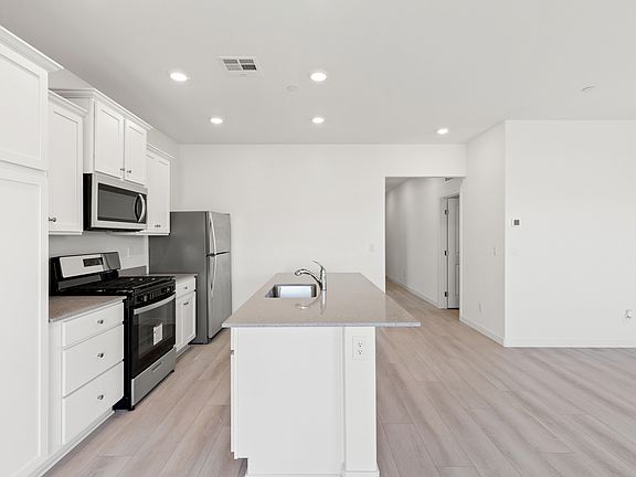 A spacious kitchen island is the perfect spot for a quick meal.