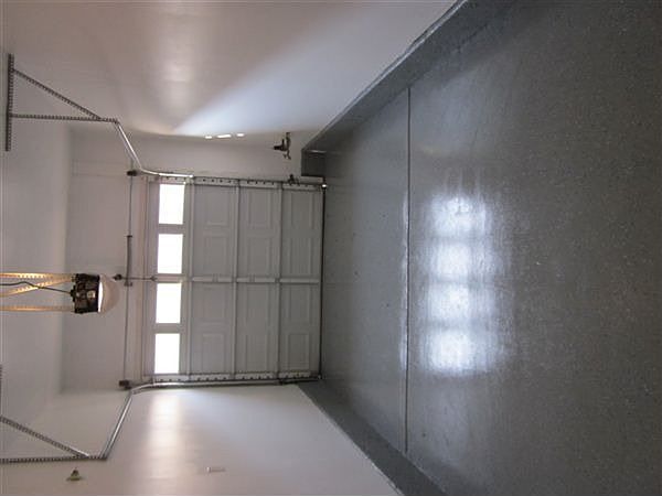 1 car attached garage with sealed floor and opener