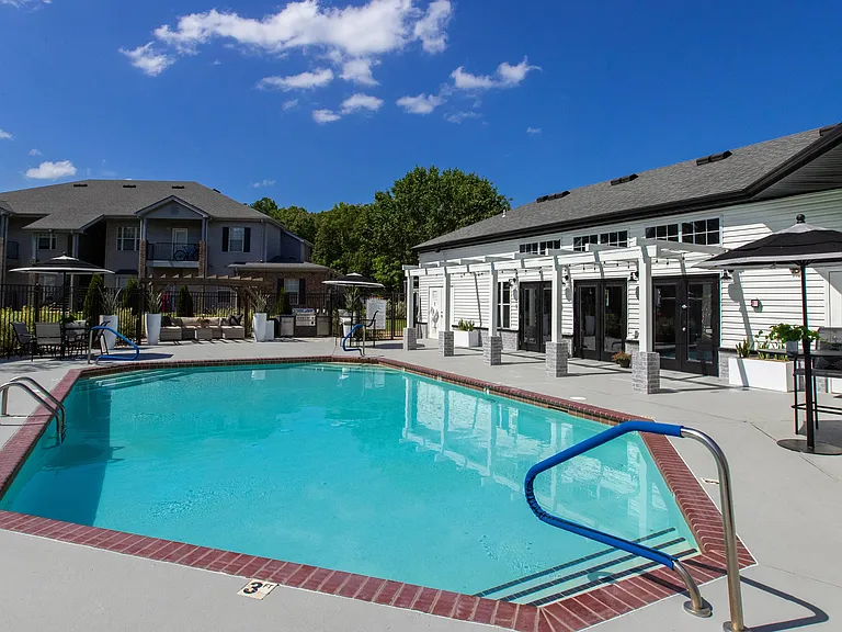 Dive into the glimmering waters of our resort-style pool and relax on the expansive sundeck, a true oasis for your Arkansas lifestyle.