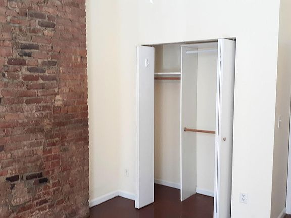 Exposed Brick & Bedroom Closet