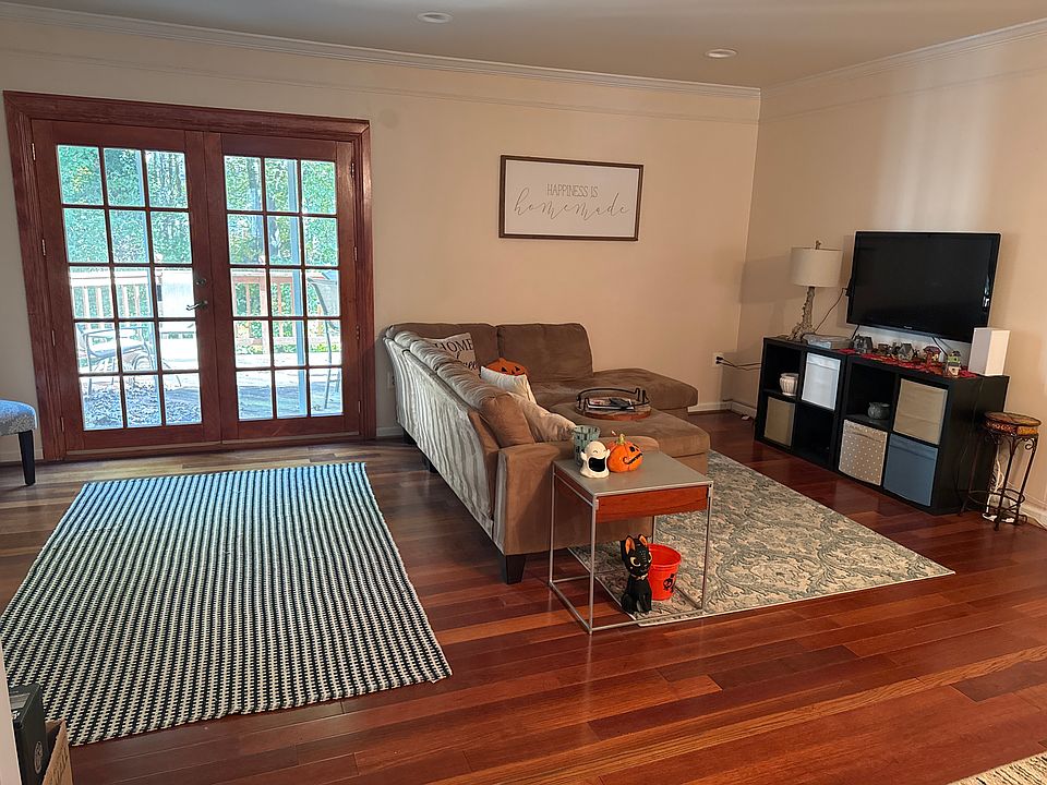 Shared living room and entry door to the deck