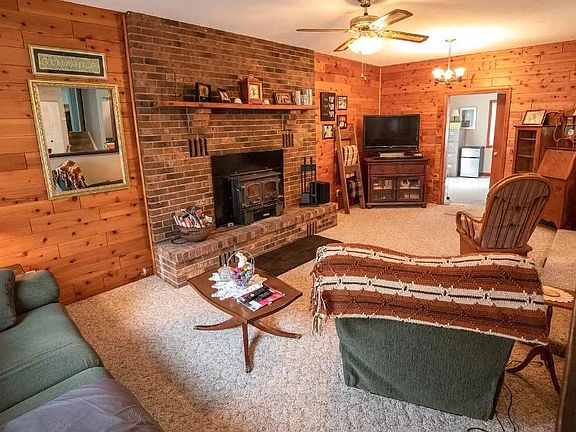 Living Room - This room has been painted to lighten it up. The fireplace designed to provide heat for the house. Stay tuned for an updated photo.