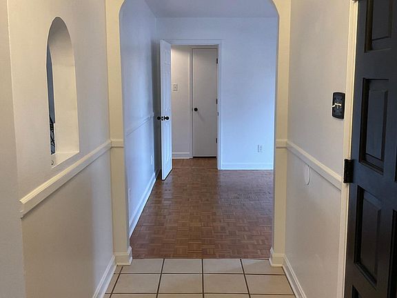 Attractive Foyer with arched doorways welcomes you into home.